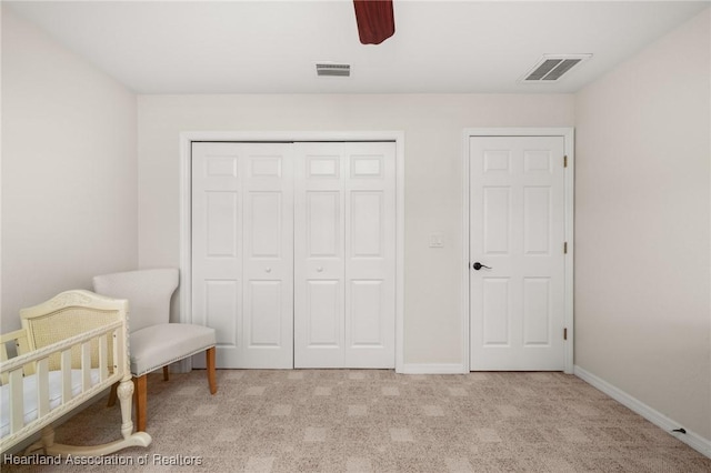 4023 Santa Barbara Dr, Sebring, FL 33875 - bedroom featuring light colored carpet, a closet, baseboards, and ceiling fan