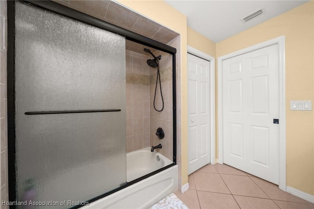 4023 Santa Barbara Dr, Sebring, FL 33875 - bathroom with baseboards, tile patterned floors, and bathing tub / shower combination