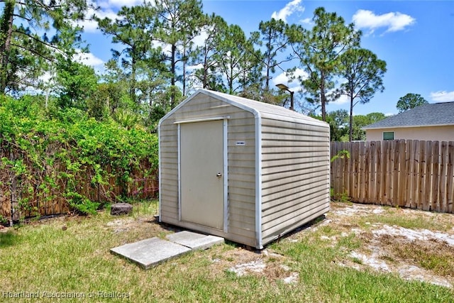 view of shed featuring a fenced backyard