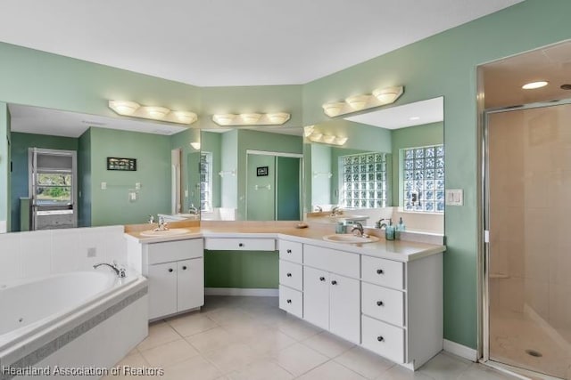 bathroom featuring separate shower and tub, tile patterned flooring, and vanity