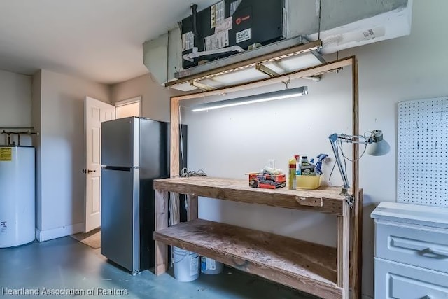 kitchen featuring stainless steel fridge and gas water heater