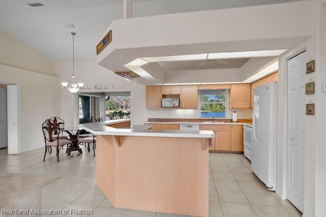 kitchen featuring light brown cabinetry, a kitchen island, white appliances, and light tile patterned floors