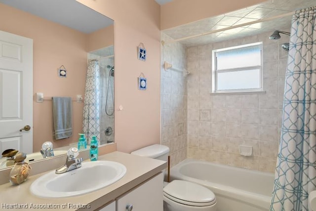 full bathroom with shower / tub combo, vanity, and toilet