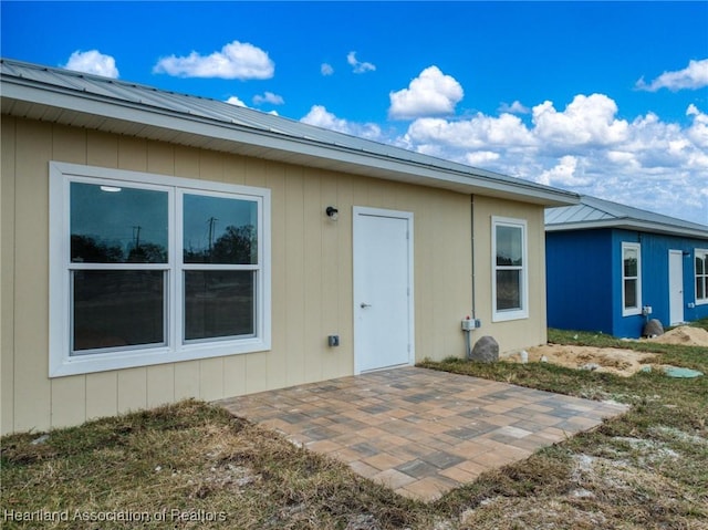 entrance to property with a patio area