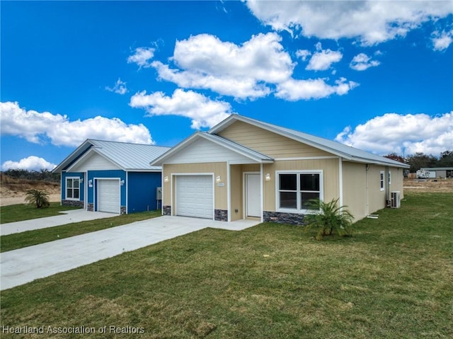 single story home featuring a garage and a front yard