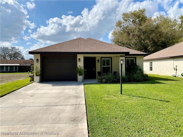 single story home with an attached garage, a front lawn, and stucco siding