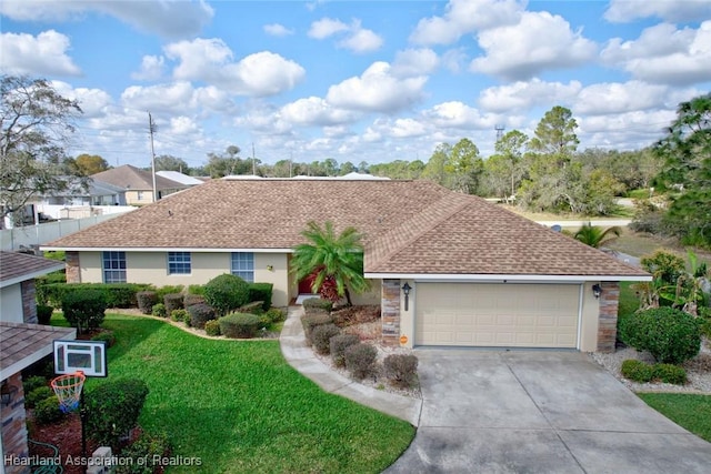 single story home featuring a garage and a front lawn