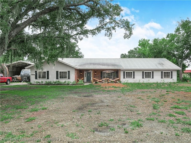 1494 Wilde St, Avon Park, FL 33825 - single story home with a detached carport and a metal roof