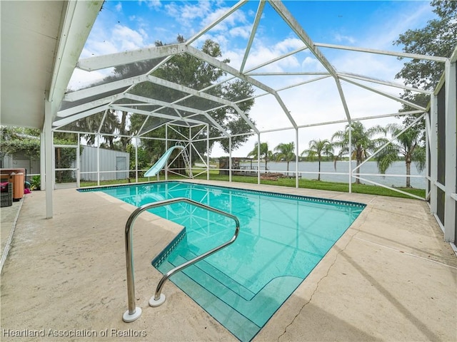 1494 Wilde St, Avon Park, FL 33825 - view of swimming pool featuring a water slide, a patio area, and glass enclosure