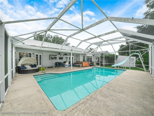 1494 Wilde St, Avon Park, FL 33825 - swimming pool with french doors, a hot tub, a water slide, a patio area, and ceiling fan