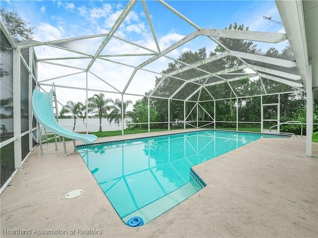 1494 Wilde St, Avon Park, FL 33825 - outdoor pool featuring a water slide, a patio area, and glass enclosure