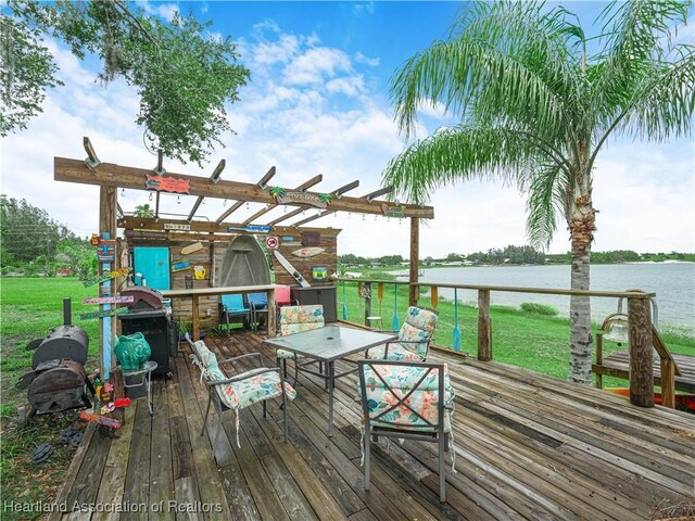 1494 Wilde St, Avon Park, FL 33825 - deck featuring a water view, a yard, outdoor dining area, and a grill