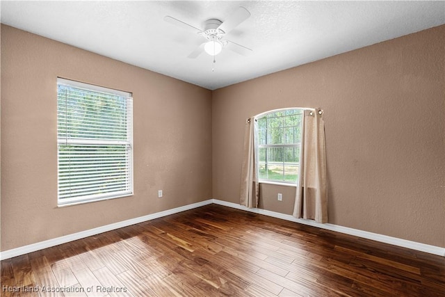 7343 Cortez Blvd, Sebring, FL 33872 - empty room with wood finished floors, ceiling fan, a textured wall, and baseboards