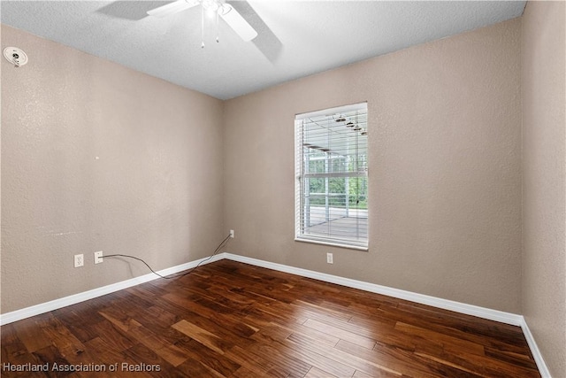 7343 Cortez Blvd, Sebring, FL 33872 - empty room featuring dark wood finished floors, ceiling fan, and baseboards