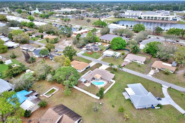 bird's eye view with a residential view and a water view