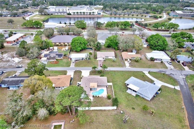 aerial view with a water view and a residential view