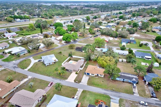 birds eye view of property with a residential view
