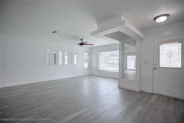 entrance foyer featuring a ceiling fan, baseboards, visible vents, and wood finished floors