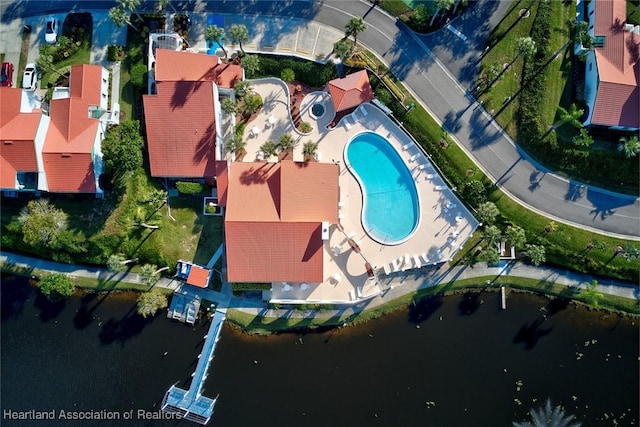 birds eye view of property with a water view