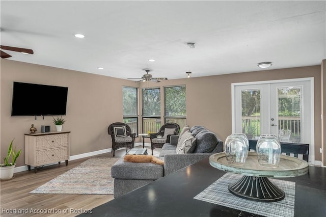 living room featuring french doors, ceiling fan, and hardwood / wood-style floors