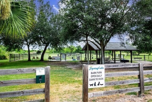 view of community featuring fence and a gazebo