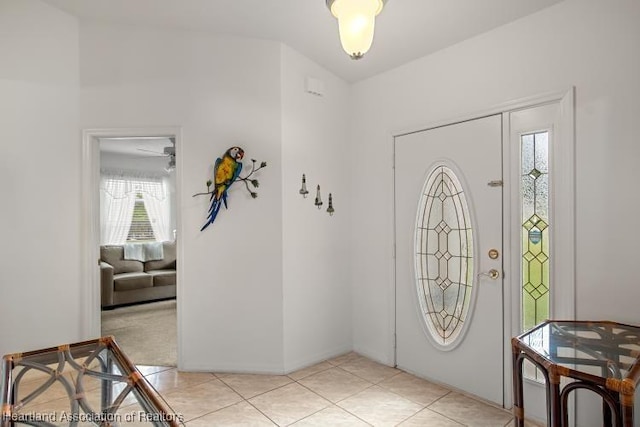 foyer entrance with light tile patterned flooring