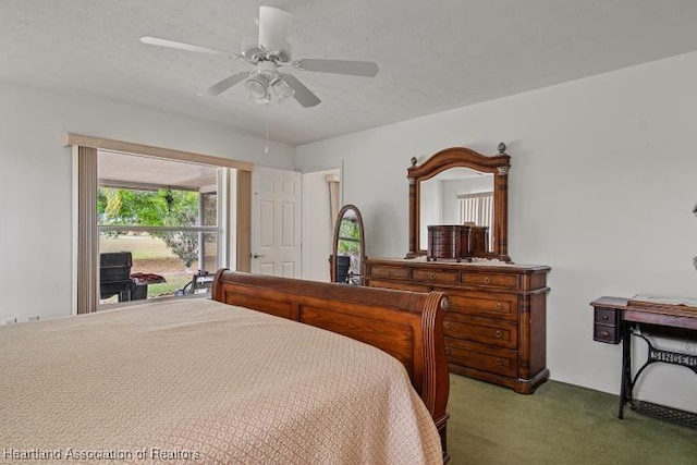 bedroom featuring a textured ceiling, a ceiling fan, and carpet flooring