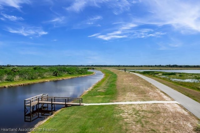 dock area with a water view