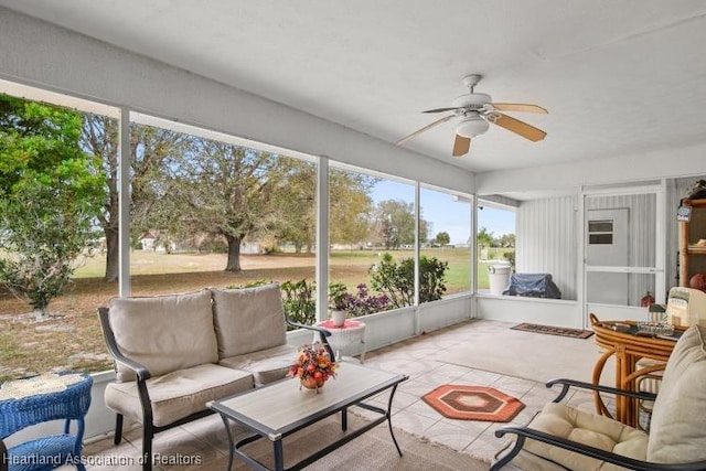 sunroom with a ceiling fan