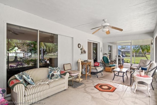 sunroom featuring a ceiling fan