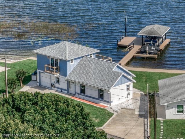 birds eye view of property featuring a water view