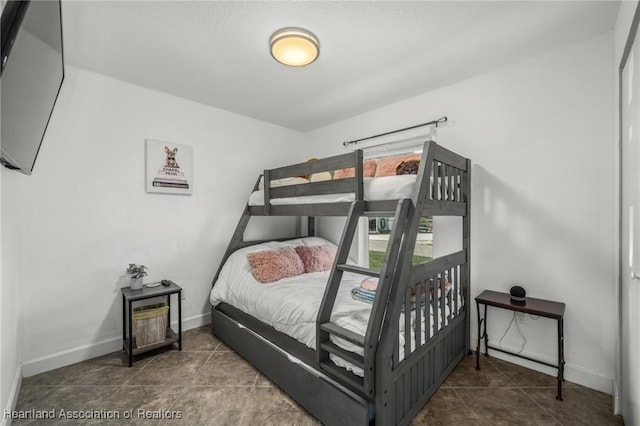 tiled bedroom with baseboards