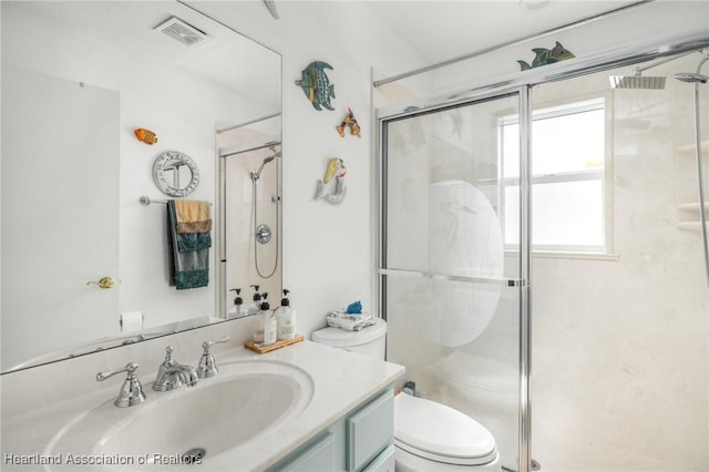 full bath with toilet, visible vents, and a shower stall