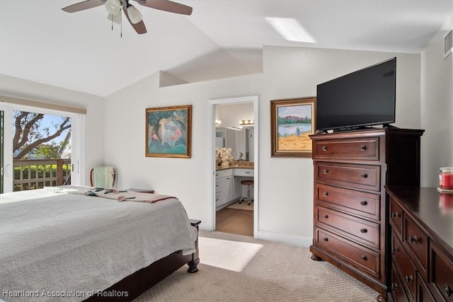 bedroom with light carpet, access to exterior, vaulted ceiling, ceiling fan, and connected bathroom