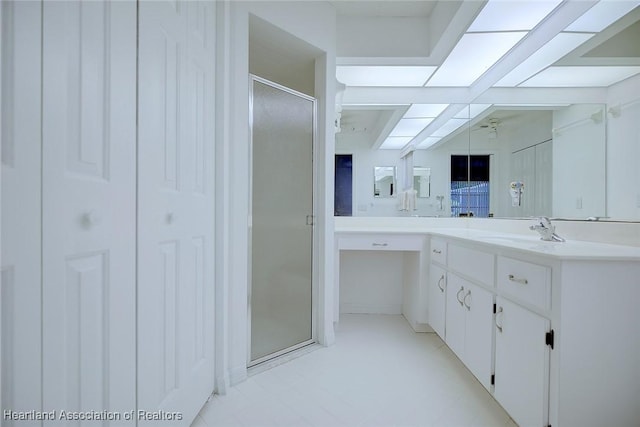 full bathroom featuring vanity and a shower stall