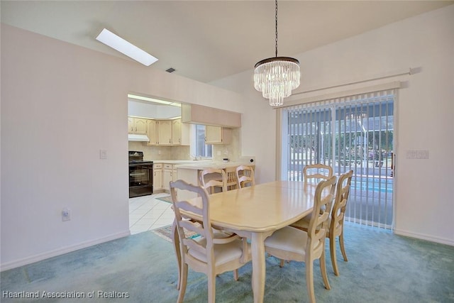 dining space with baseboards, visible vents, light carpet, and a notable chandelier