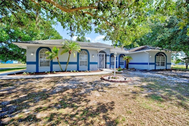 ranch-style home with stucco siding