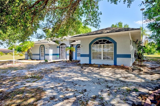 single story home with stucco siding