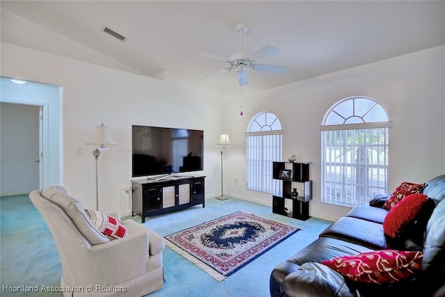carpeted living area featuring baseboards, a ceiling fan, vaulted ceiling, and visible vents