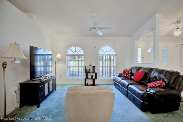 carpeted living room with ceiling fan and baseboards