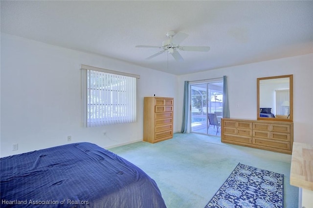 bedroom featuring access to outside, carpet flooring, and ceiling fan