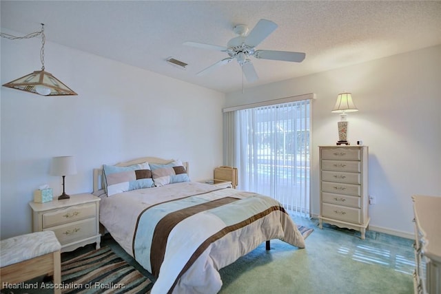 bedroom with carpet floors, ceiling fan, baseboards, and visible vents