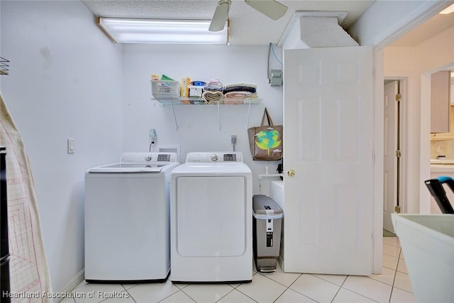 washroom with washer and dryer, light tile patterned flooring, laundry area, and ceiling fan