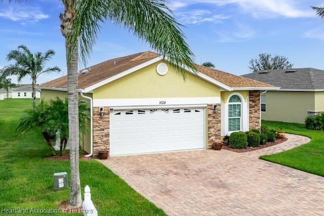 ranch-style house featuring a front yard and a garage