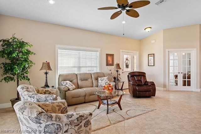 tiled living room featuring ceiling fan and french doors