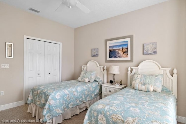 carpeted bedroom with a closet and ceiling fan