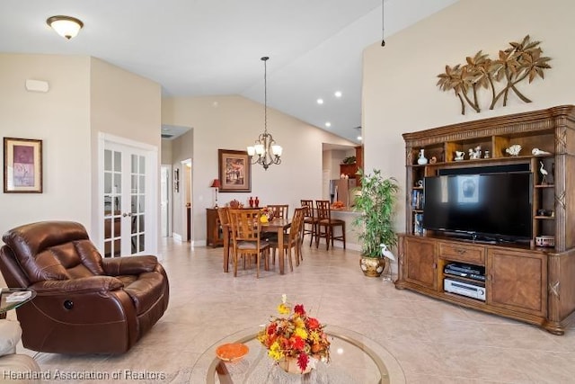 living room with french doors, vaulted ceiling, and a notable chandelier