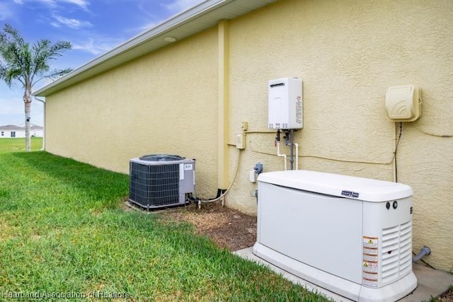 view of side of property featuring a yard and central AC unit