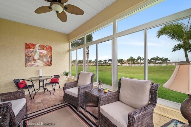 sunroom / solarium with ceiling fan