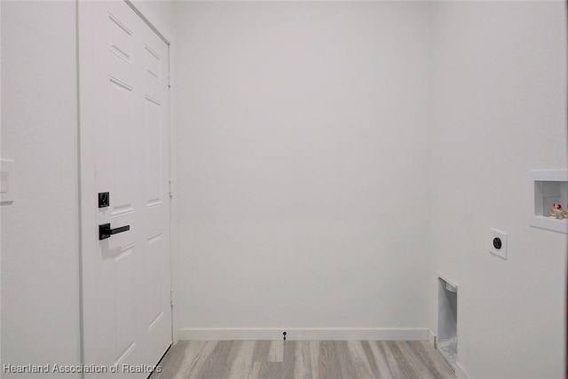 clothes washing area featuring hookup for a washing machine, light wood-type flooring, and electric dryer hookup